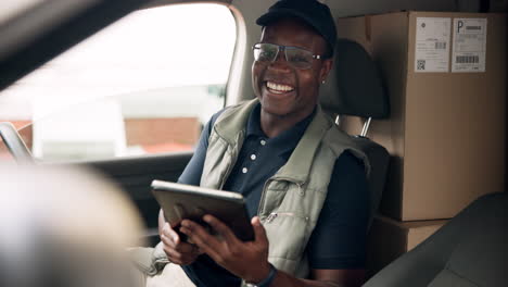 delivery driver with tablet in vehicle