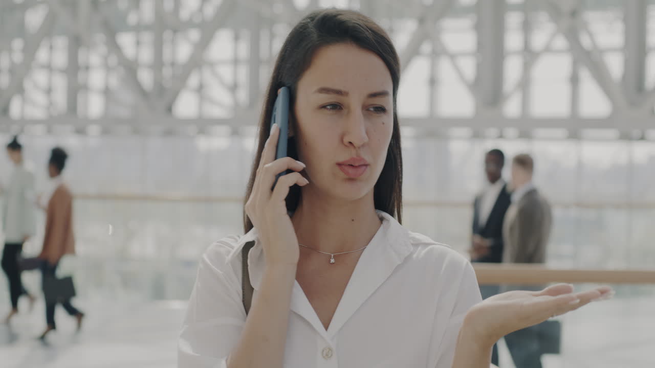Woman on Phone in Modern Building