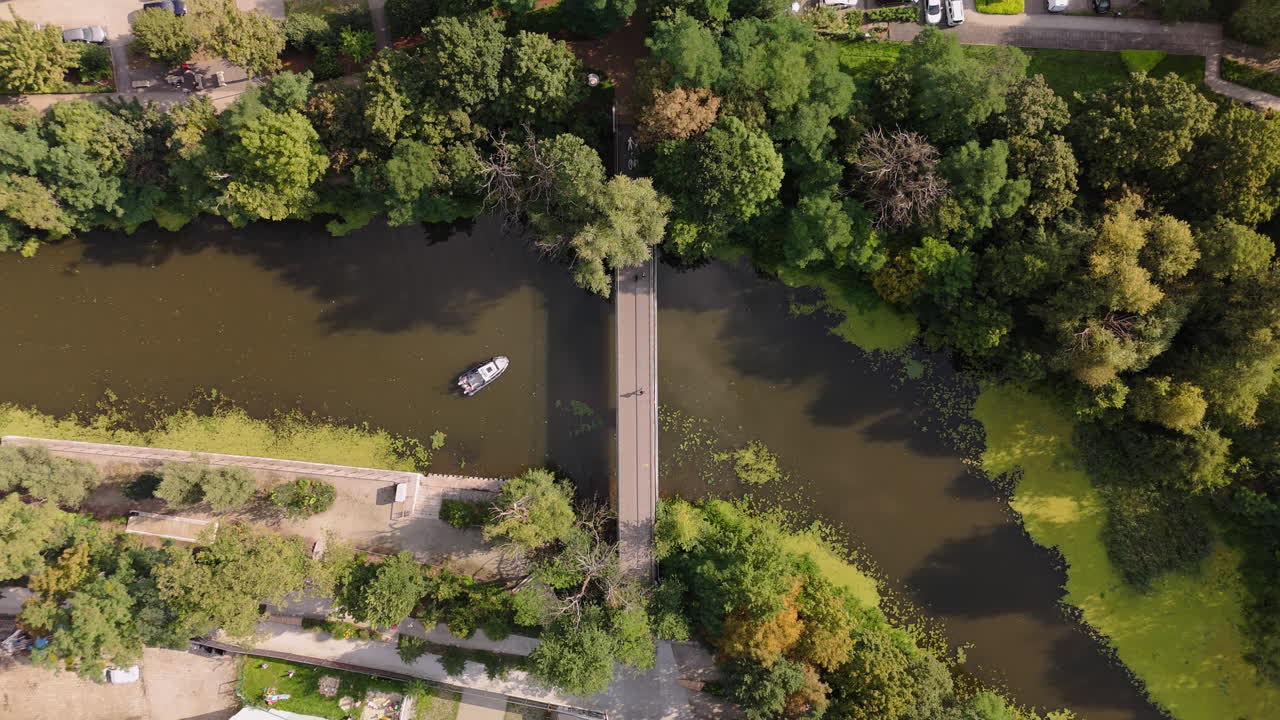 Aerial view of a bridge over a canal in a park
