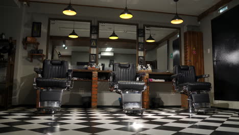 the camera on the steadicam shows the interior of a barber shop with a beautiful design.