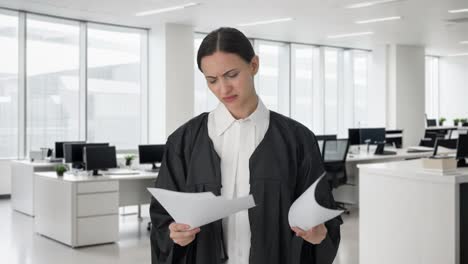 Angry-Indian-female-lawyer-reading-case-files