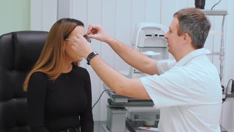 consultation with an ophthalmologist. medical equipment. coreometry. professional ophthalmologist examining
