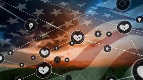 animation of network of digital icons over waving american flag against sunset sky