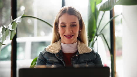 woman working on laptop in office setting