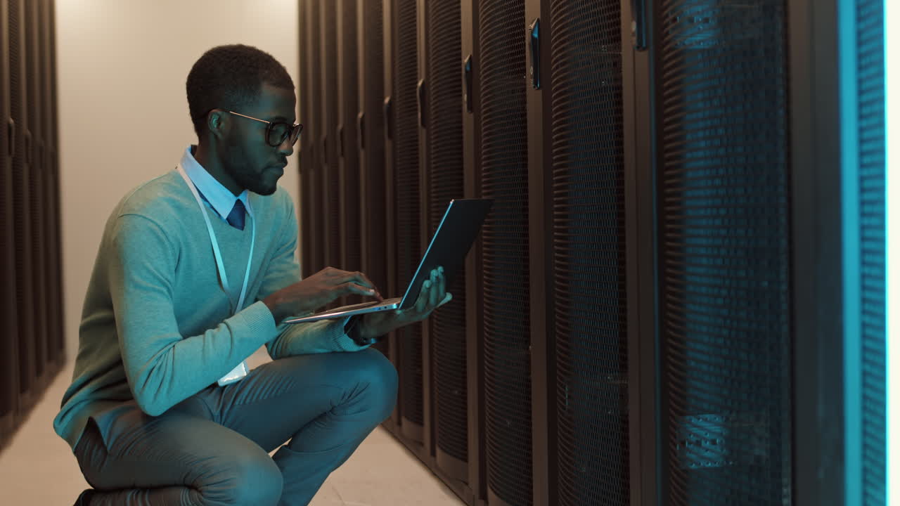 IT Specialist Analyzing Work of Data Center