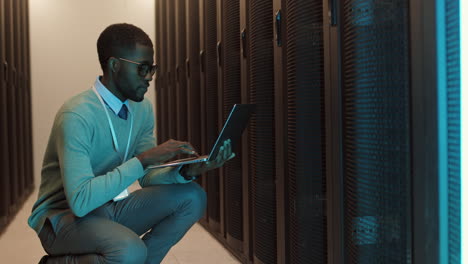 it specialist analyzing work of data center