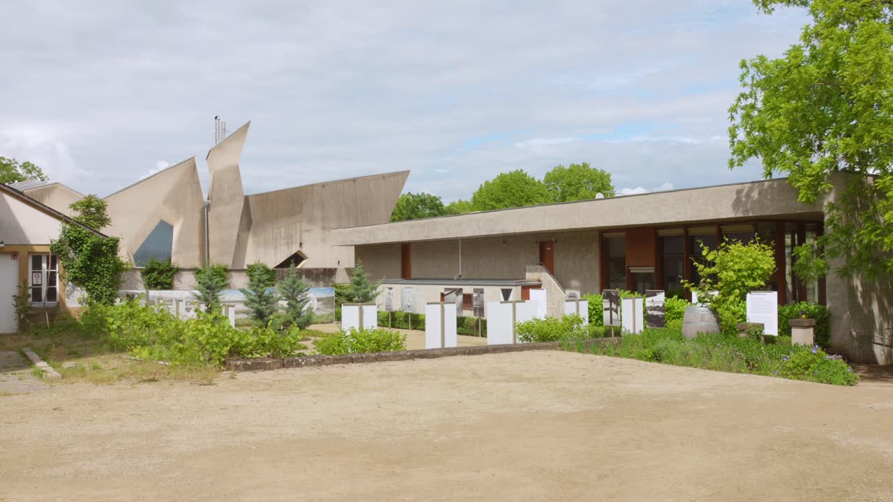 Modern architecture at the European Museum in Schengen, surrounded by greenery and open space