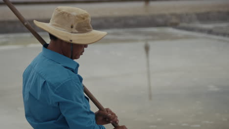 a worker in a salt pan