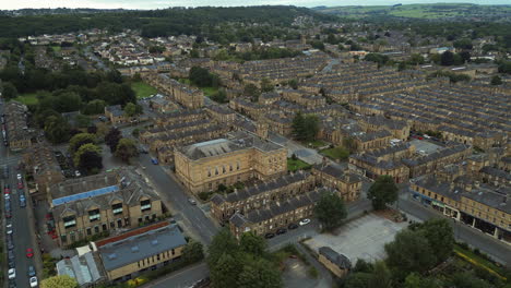 establishing drone shot over saltaire terraced houses and victoria hall