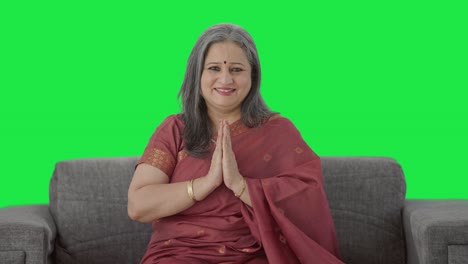 Happy-Indian-old-woman-greeting-and-doing-Namaste-Green-screen