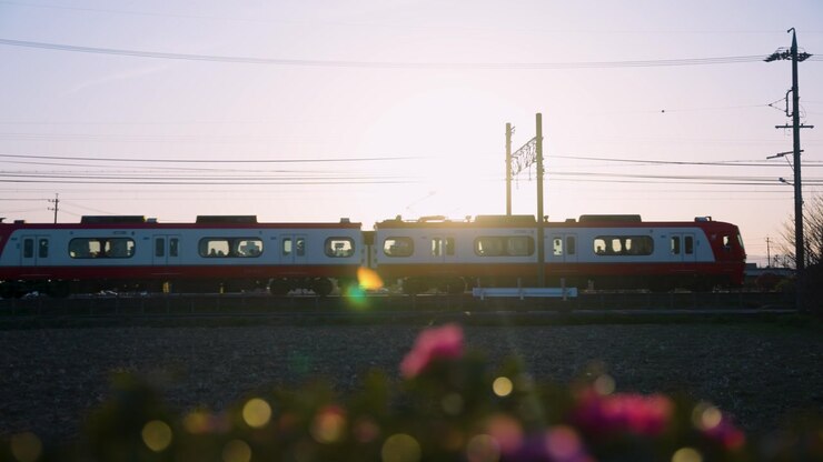 Sunset in Japanese Countryside as Train Passes on Warm Day 4k Slow Motion