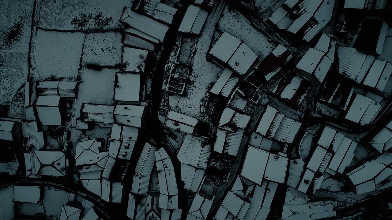 Aerial View of Mountain Village in Snow at Night