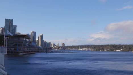 An-establishing-shot-of-Coal-Harbour-with-Canada-Place-flag-and-windy-waters