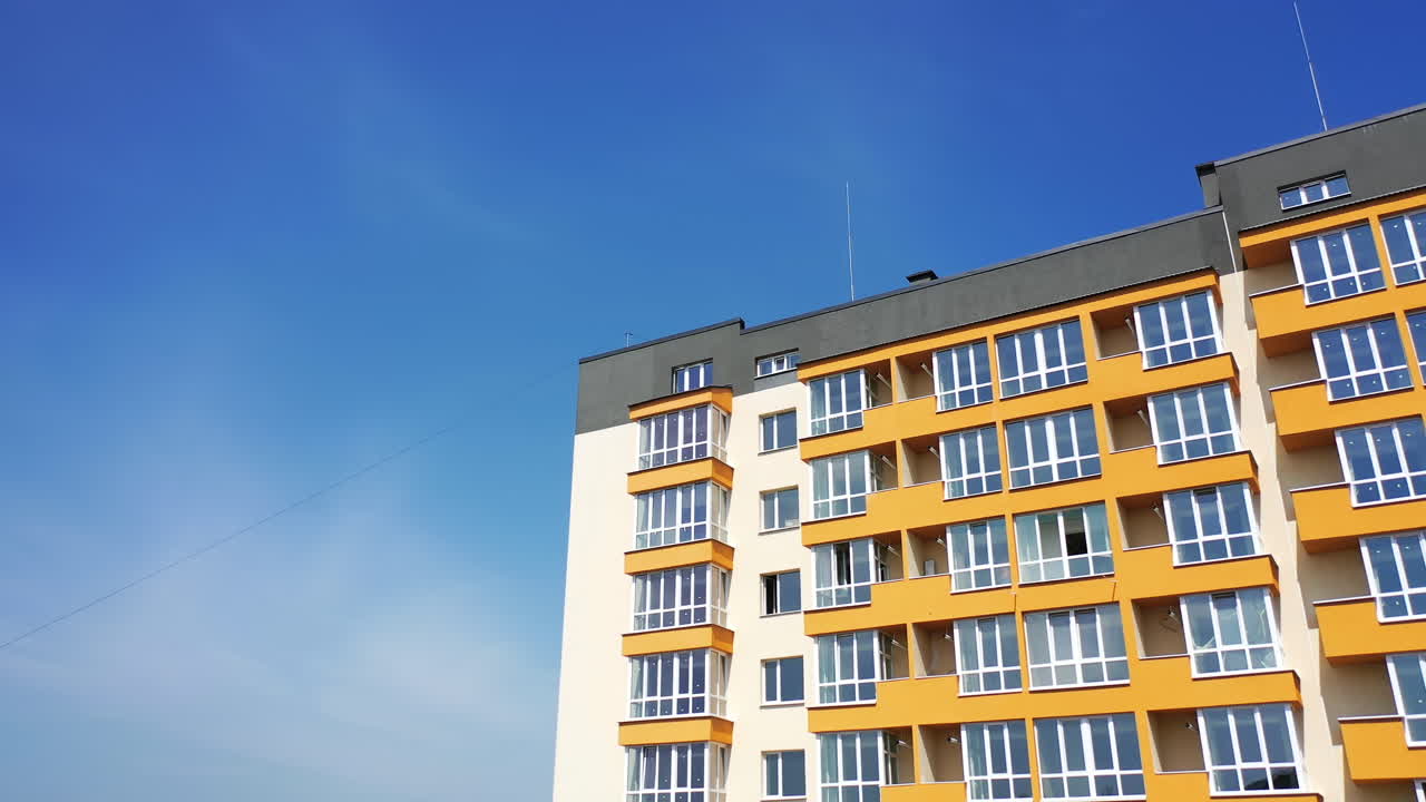 Orange and Cream Multi-Story Apartment Building