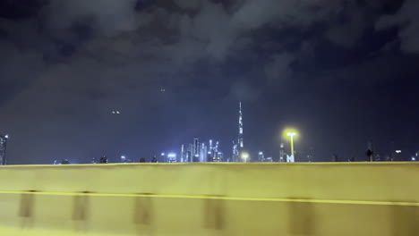 city of dubai seen from far away while driving