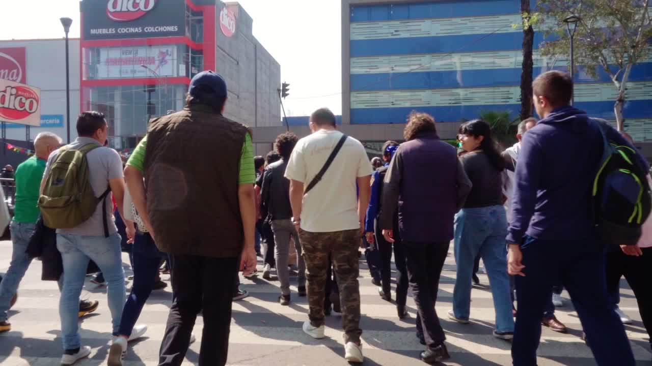 People Crossing the Street in a Busy City