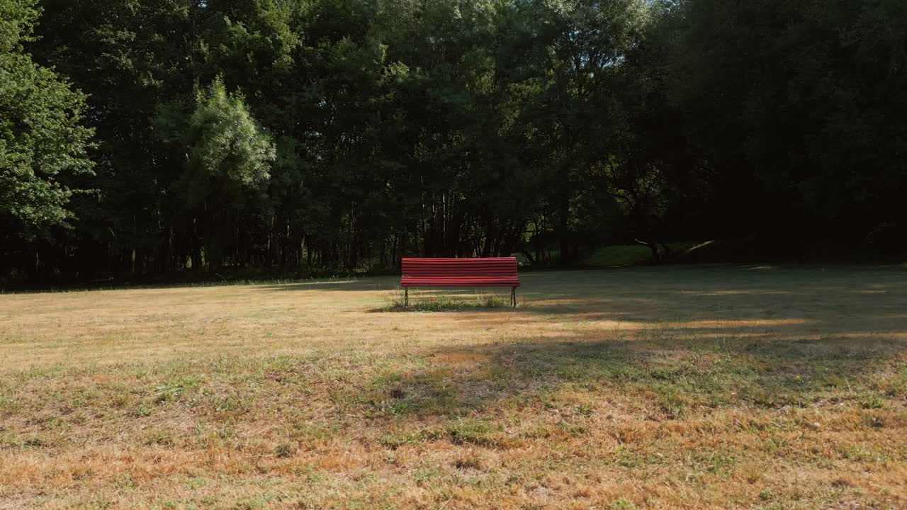 Park Bench In The Field - Drone Shot