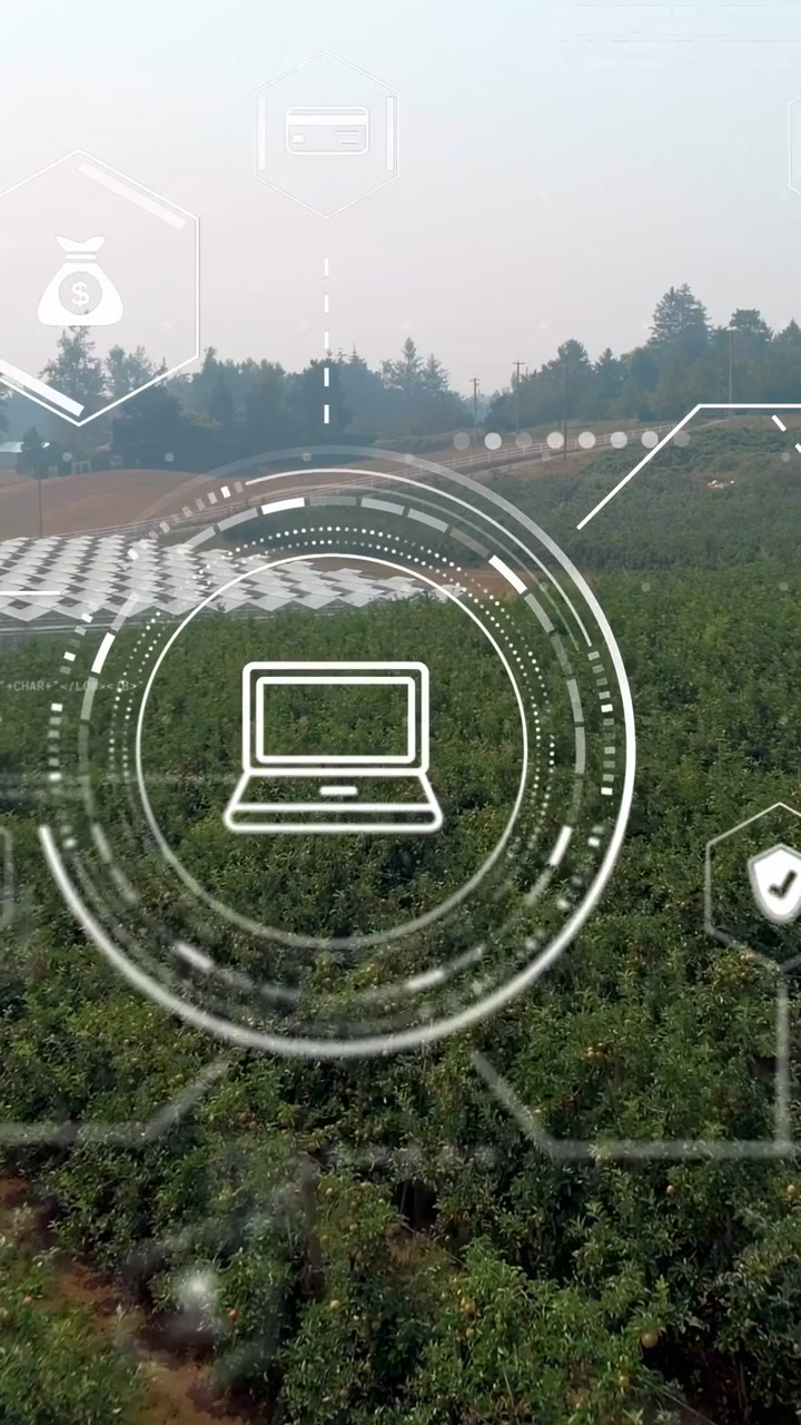 Video verticale: Icona di dispositivo HUD che appare, anelli che si espandono e ruotano, laptop che pulsa per i dati del raccolto.
