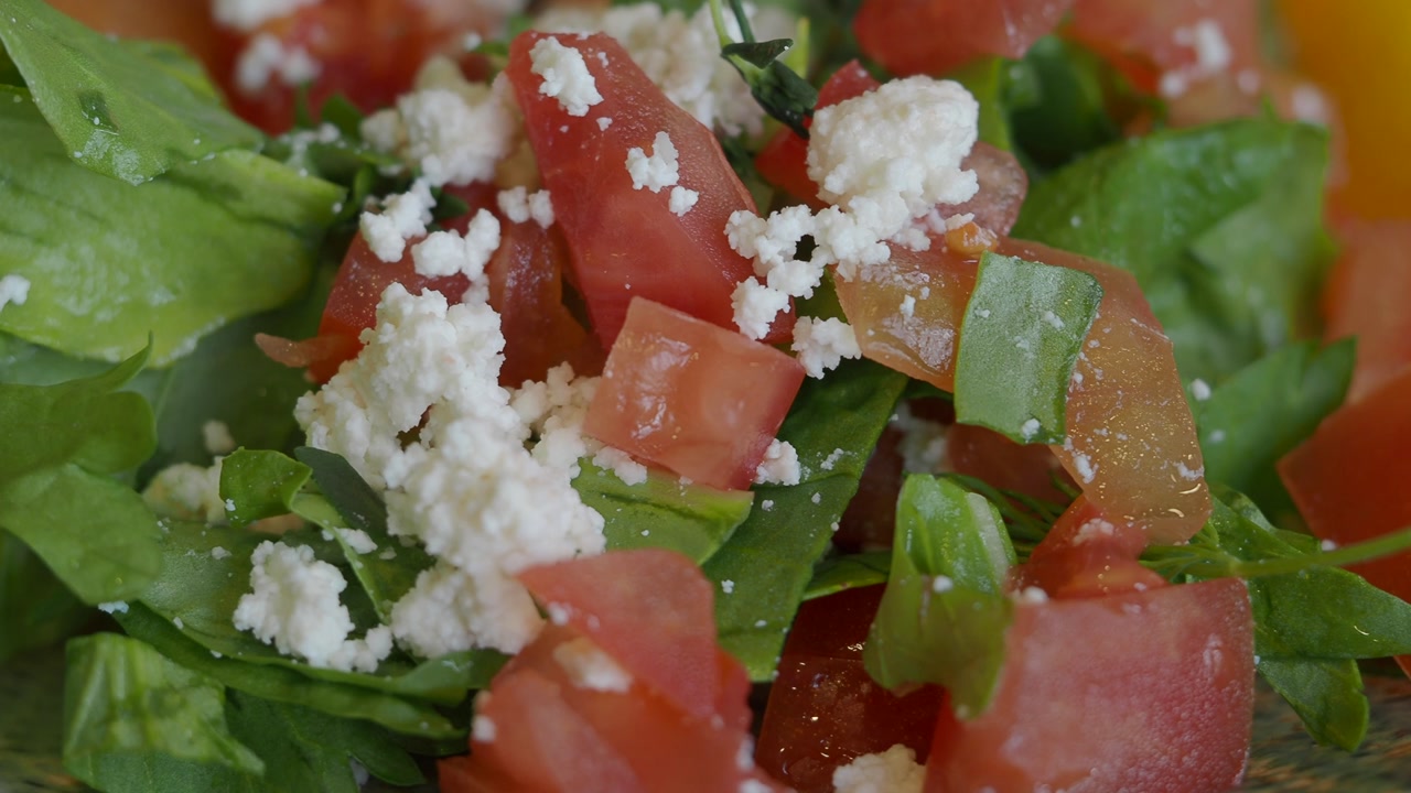 Healthy Salad with Fresh Tomatoes, Green Leaves, and Feta Cheese