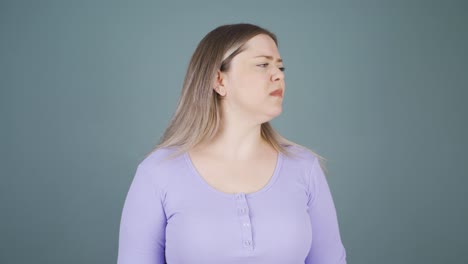 young woman getting angry at camera.