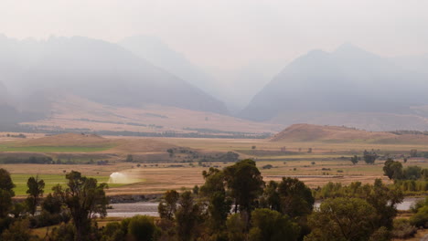 mountain valley landscape with farmland and river
