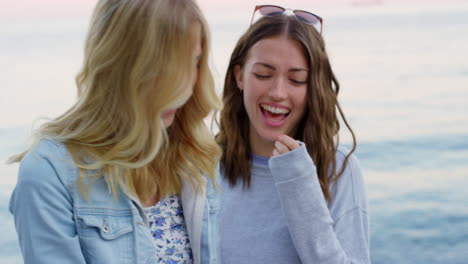 Friends,-phone-and-happy-on-beach-for-summer