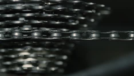 Close-up-of-bicycle-chain-and-bike-gears-turning