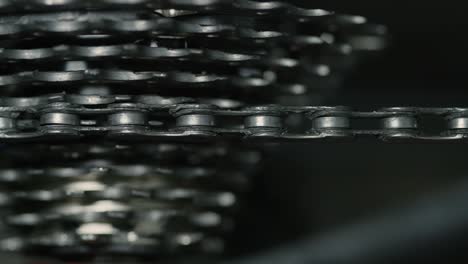 close up of bicycle chain and bike gears turning