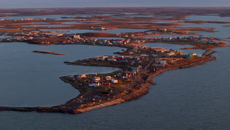 Hamlet Of Tuktoyaktuk Lies Above The Beaufort Sea In Northwest Territories, Canada. aerial, wide shot