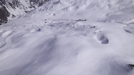 High-Level-Drone-Footage-of-Ski-Touring-in-the-Alps---Tilt-Up-Shot-and-Dolly-In-Shot---Shot-in-Tignes-and-Val-d'Isere