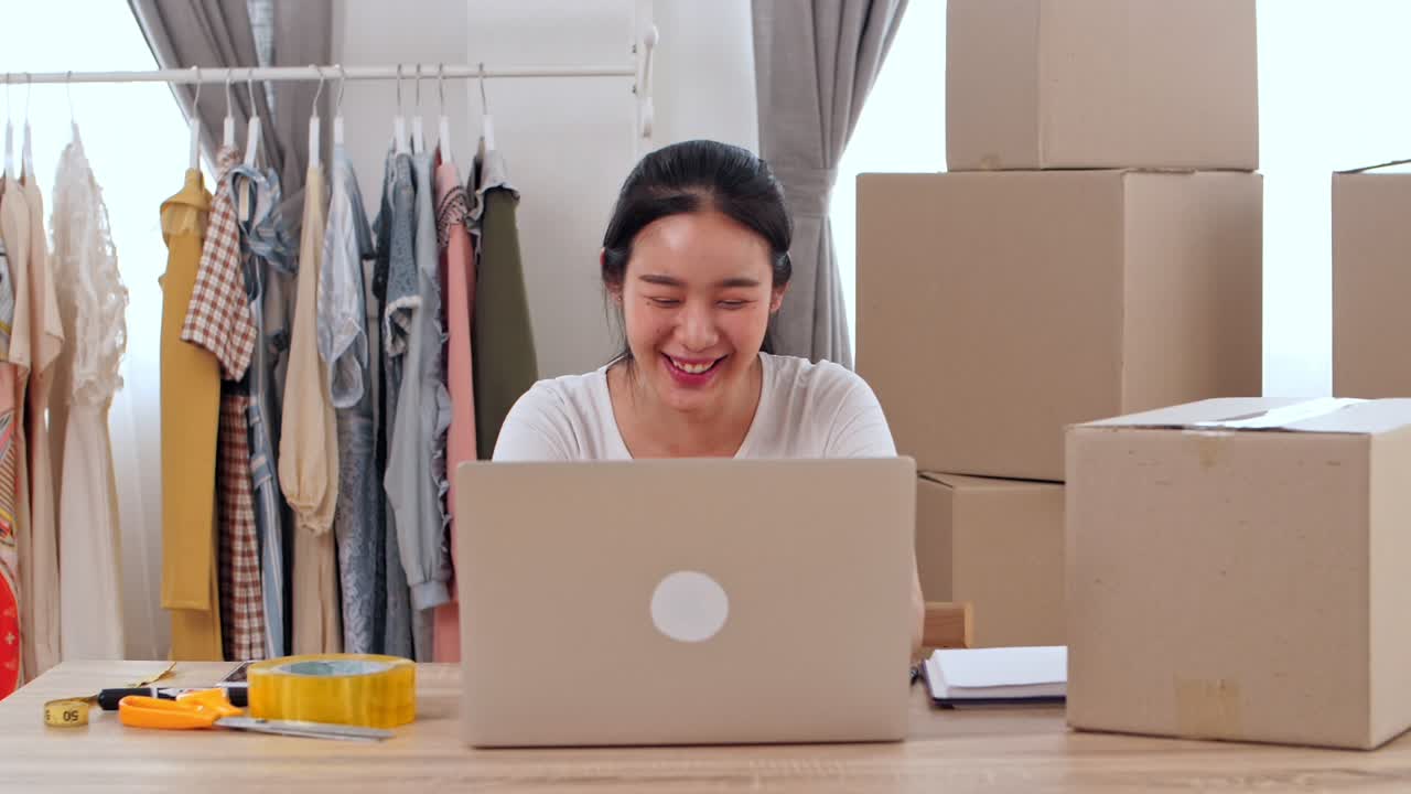 Young Asian Woman Entrepreneur Celebrate With Laptop