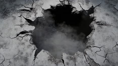 cracked earth hole with smoke
