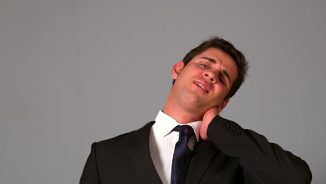 Businessman-rubbing-his-sore-neck