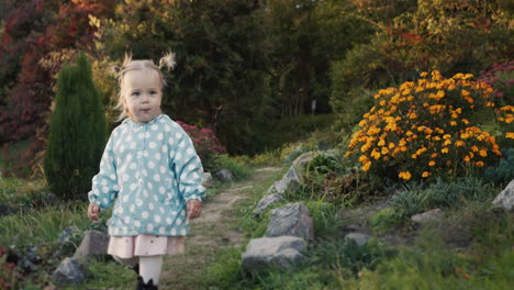 cute little girl walking in the park.