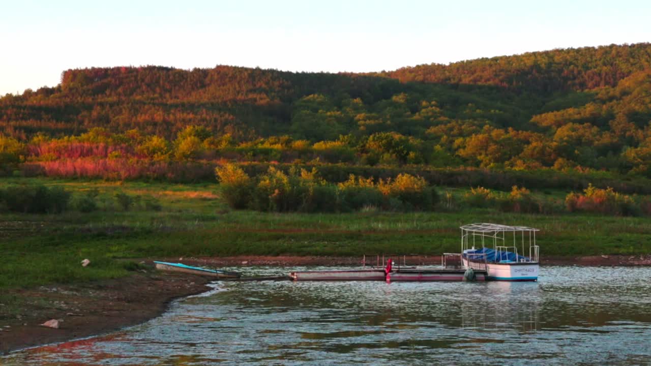 View of a boat in a lake during the golden hour