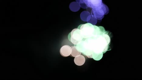 Out-of-Focus-Fireworks-Exploding-in-Various-Colors-on-New-Year's-Eve-Illuminating-the-Night-Sky