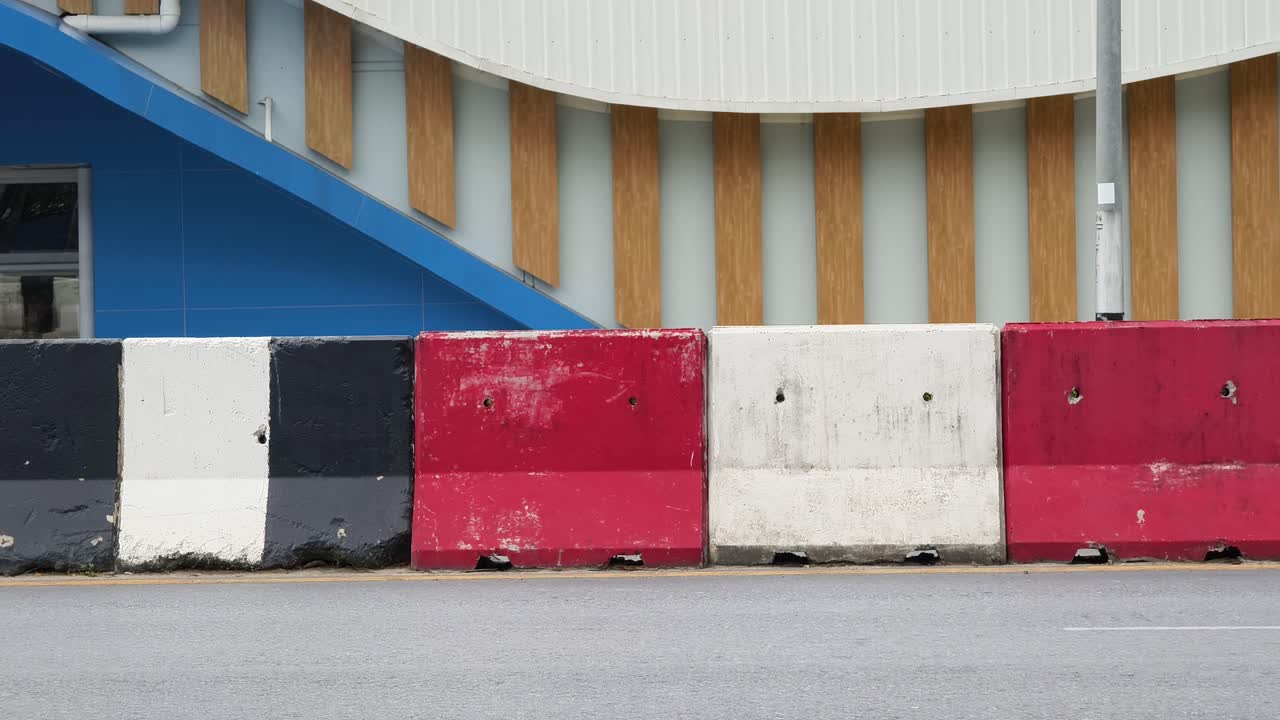 Motorcycle on street with colorful barriers