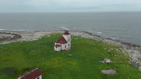 abandoned lighthouse on island, newfoundland - drone clip