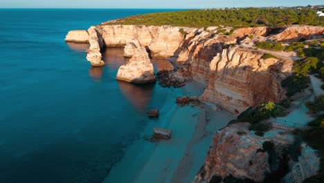 breathtaking aerial view of coastal cliffs in portugal during sunset