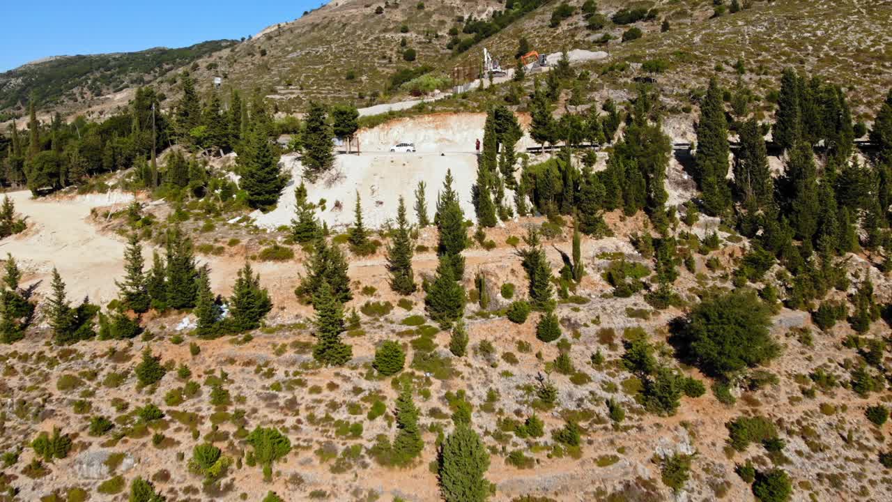 Aerial View White Rocky Hill With Trees At Daytime In The Area Of Asos In Cephalonia, Greece. - pullback