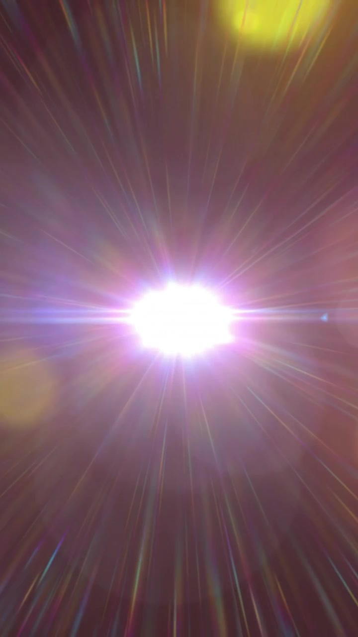 Vertical video: Bright point light ramping, forming starburst, flare and bokeh for technology demo