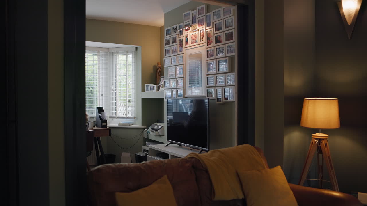 Woman working at desk in living room
