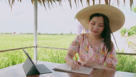 freelance young woman working with her digital tablet outside her home