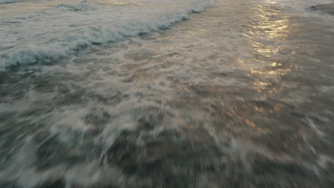 Low-Fly-Over-Breaking-Foamy-Waves-During-Dusk-At-El-Paredón-Buena-Vista,-Escuintla,-Guatemala