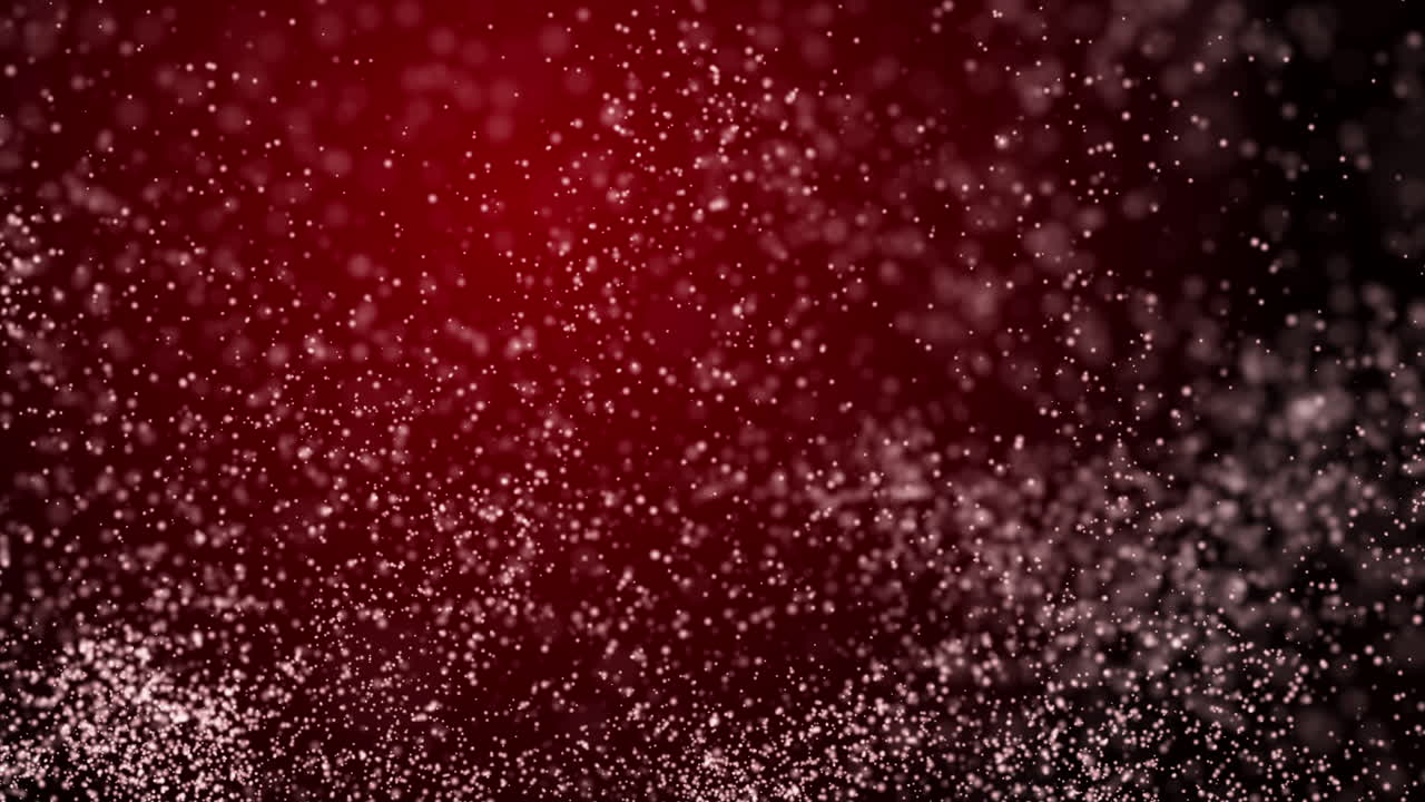 Fast chaotic movement of small white bright dust particles on a dark red background. Looped animation.