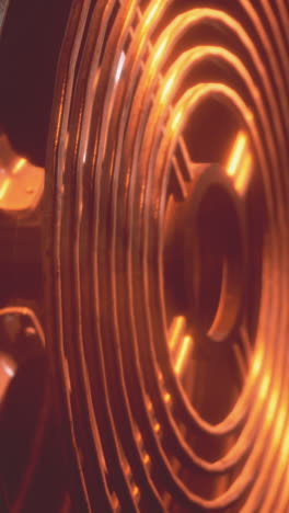 close up of a red hot heating coil on an electric stove