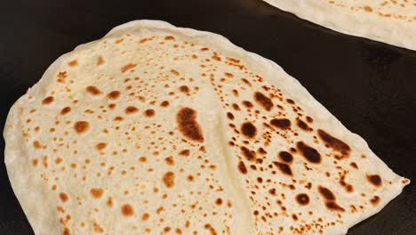 close-up of flatbread cooking on a griddle