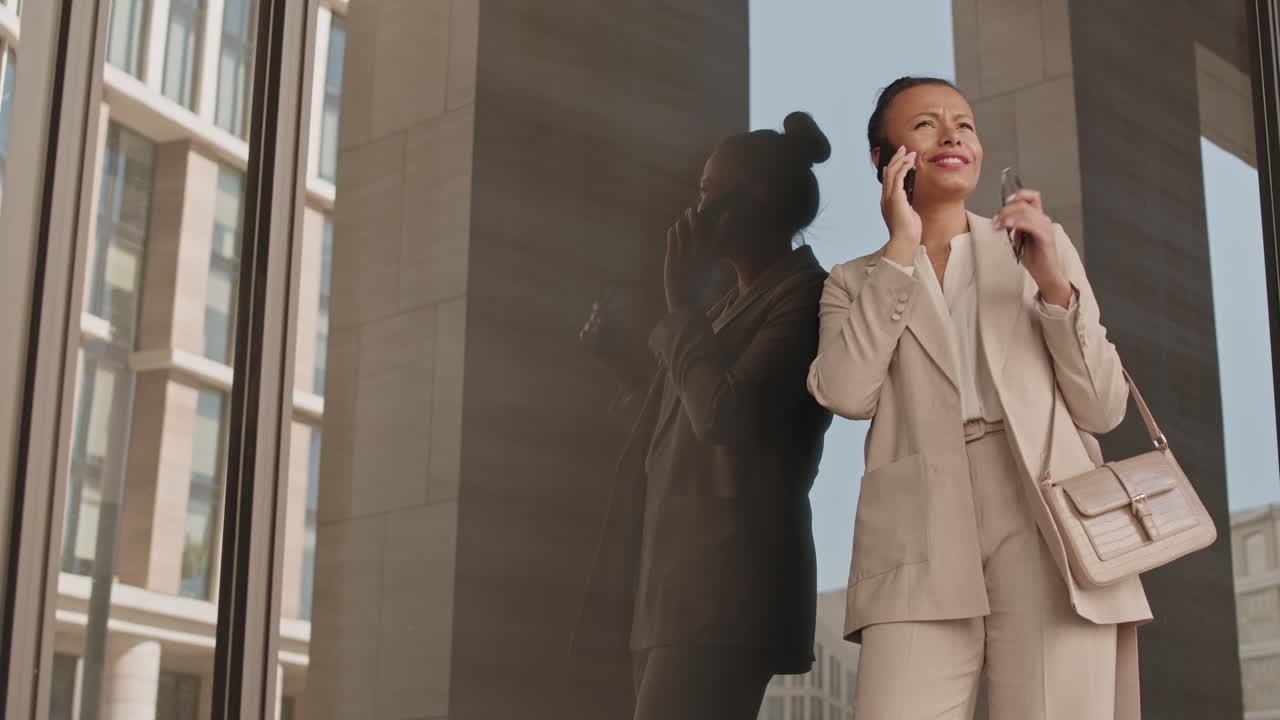 Cheerful Business Lady Making Phone Call Outdoors