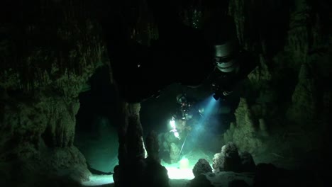 cave divers communicate deep into the dive