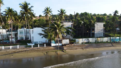 calm luxury seaside resort with palm tree in early morning, mui ne, vietnam